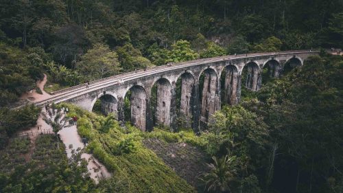 The iconic Nine Arch Bridge in Demodara Ella surrounded by lush jungle